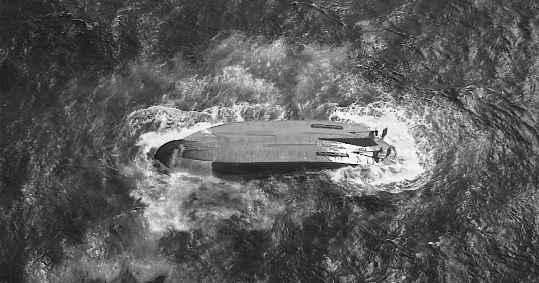 Six crew members are missing after an American ship capsized in the Pacific following a powerful typhoon.