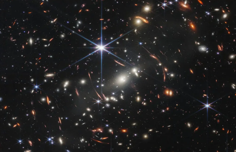 Gravitational Lens Reveals Early Galaxy 800 Million Years After Big Bang Gravitational Lens Reveals Early Galaxy 800 Million Years After Big Bang
